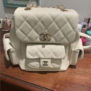 Mini backpack silver hardware, new never used. Designer inspired.